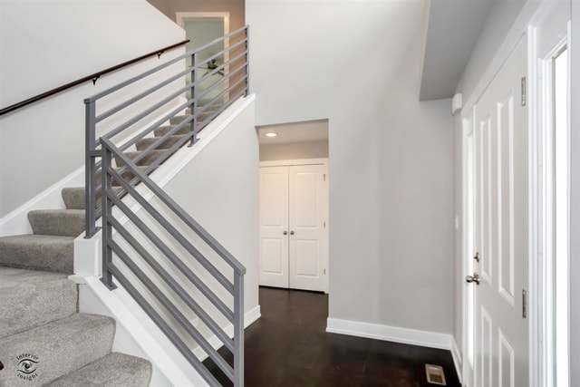 stairway featuring wood-type flooring