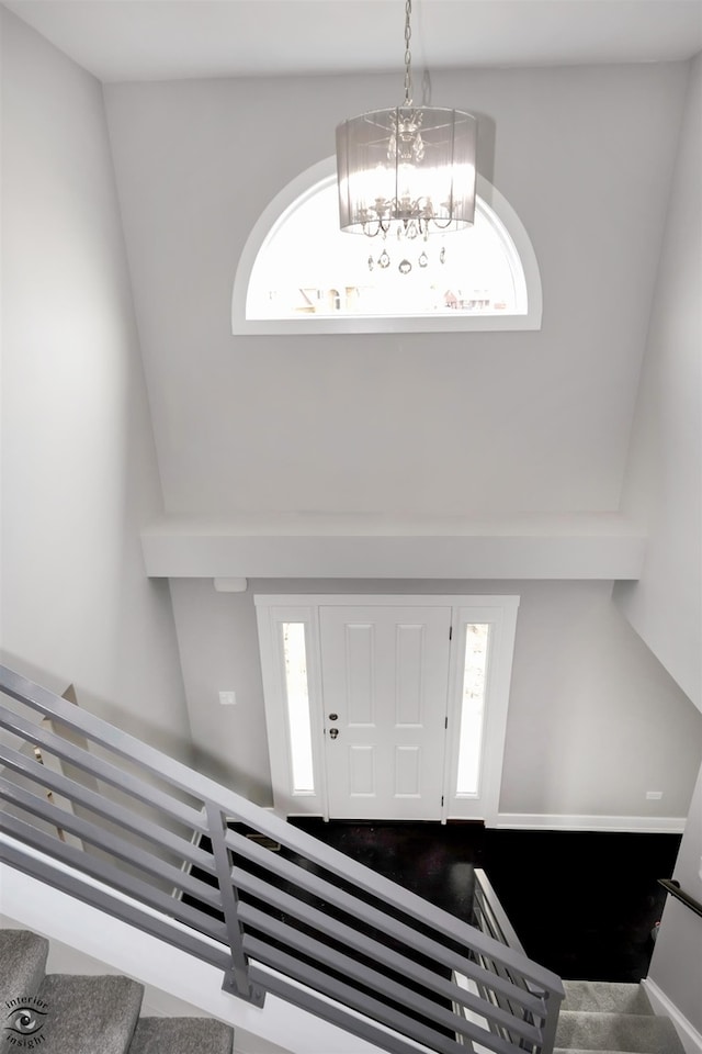 foyer with a chandelier and a wealth of natural light