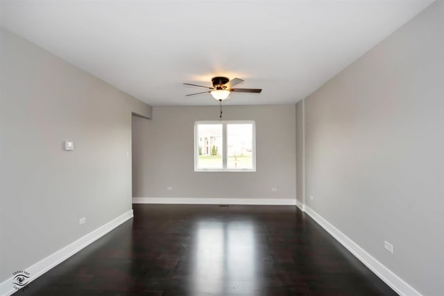 unfurnished room featuring ceiling fan and dark hardwood / wood-style flooring