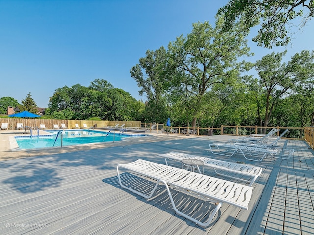 view of swimming pool with a patio area