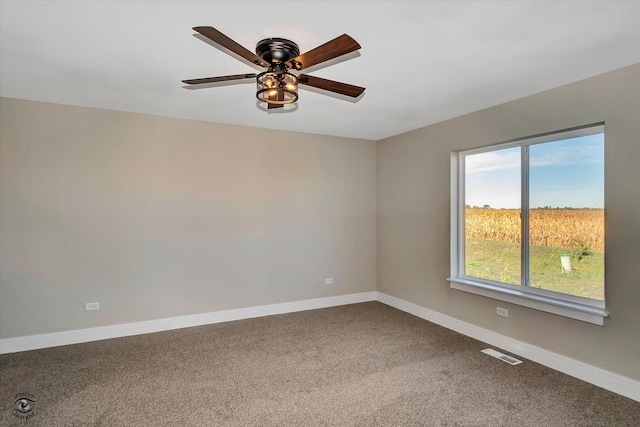 carpeted empty room with ceiling fan