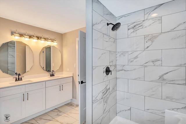 bathroom featuring vanity and tiled shower