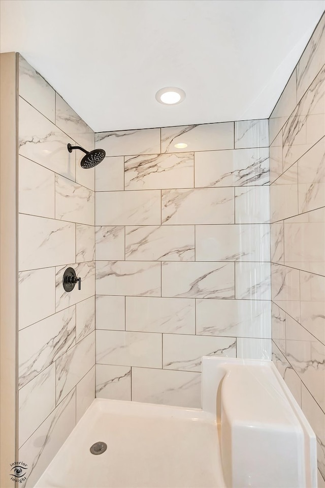 bathroom with tiled shower