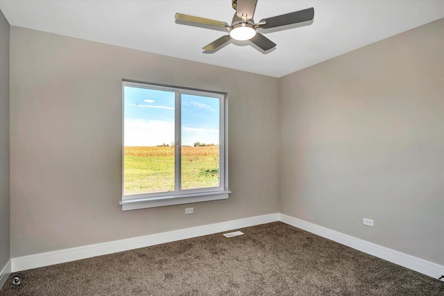 spare room with ceiling fan and carpet floors