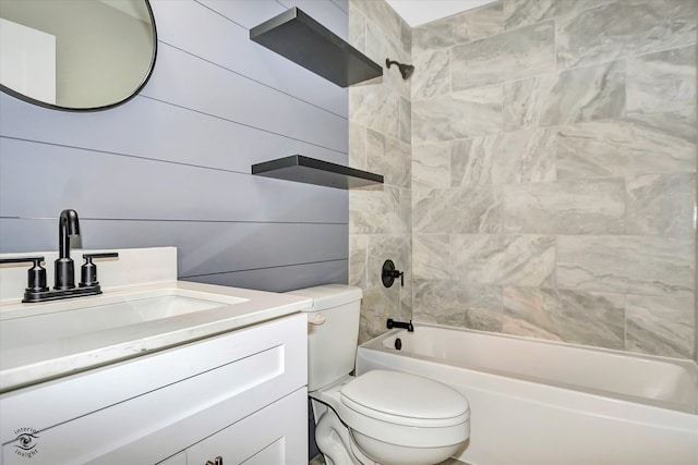 full bathroom with vanity, toilet, and tiled shower / bath