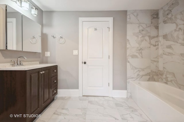 bathroom with vanity and a bathtub