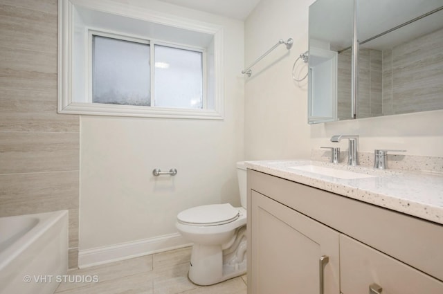 bathroom featuring tile patterned floors, vanity, and toilet