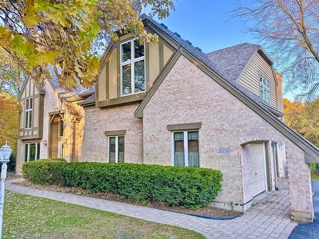 view of side of home featuring a garage