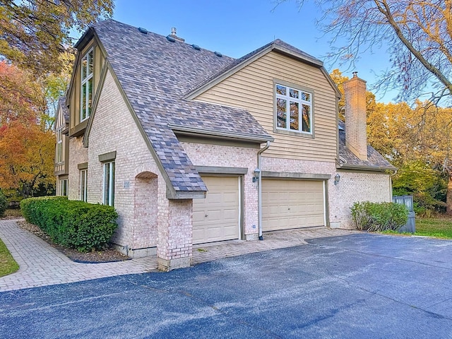 view of side of home with a garage