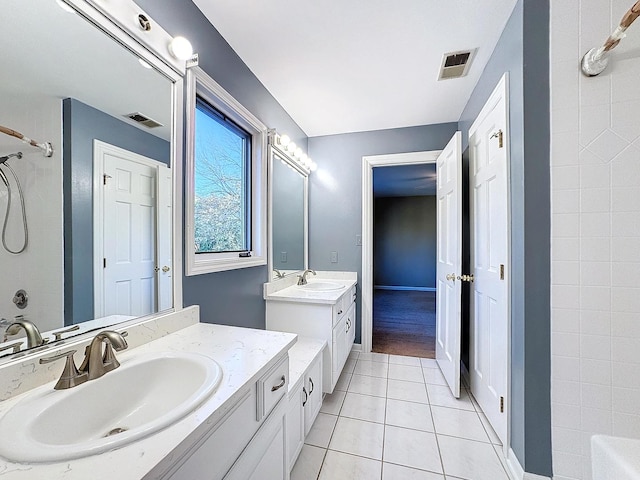 bathroom with vanity, tile patterned floors, and walk in shower