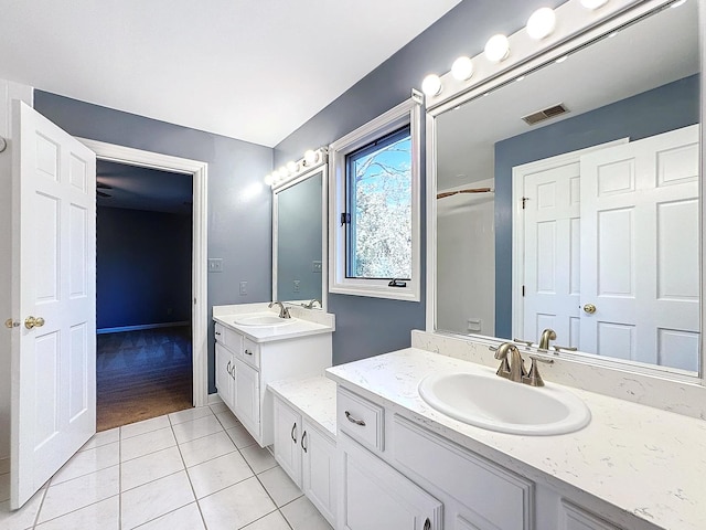 bathroom with vanity and tile patterned floors