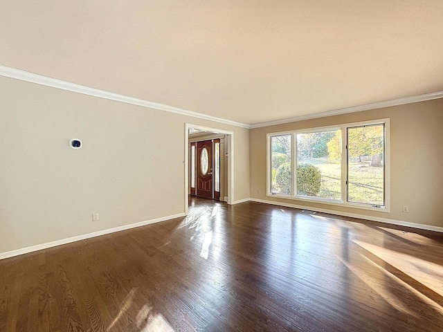 unfurnished room featuring crown molding and dark hardwood / wood-style floors