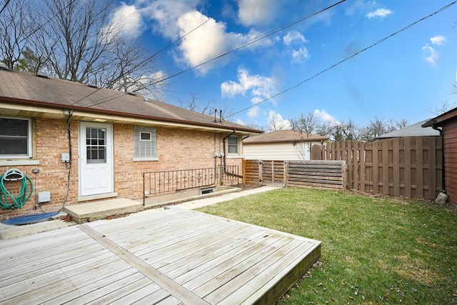 deck with fence and a lawn