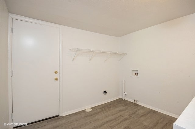 laundry room featuring hookup for a washing machine and dark hardwood / wood-style flooring