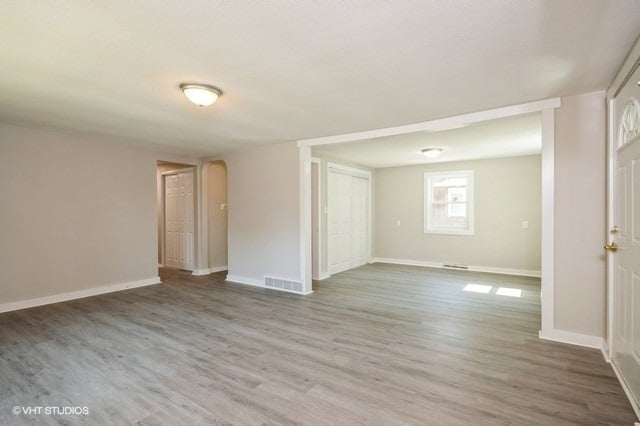 spare room with hardwood / wood-style flooring