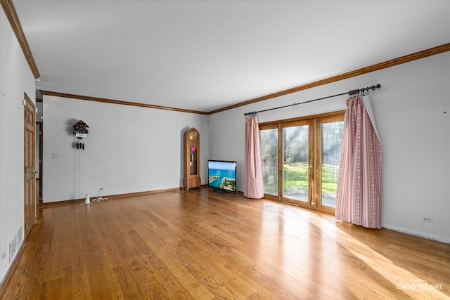 unfurnished living room with light hardwood / wood-style flooring and ornamental molding