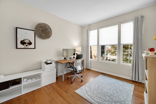 office area with light wood-type flooring