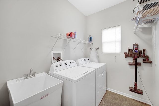 laundry room with washing machine and clothes dryer and sink