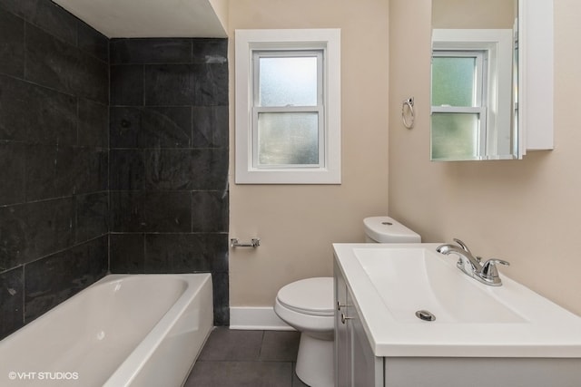 full bathroom featuring tile patterned flooring, vanity, toilet, and a wealth of natural light