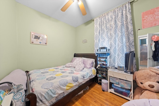 bedroom featuring wood-type flooring and ceiling fan