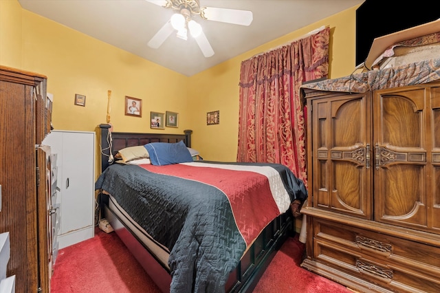 bedroom with dark carpet and ceiling fan