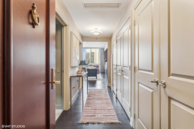 hallway with dark hardwood / wood-style flooring