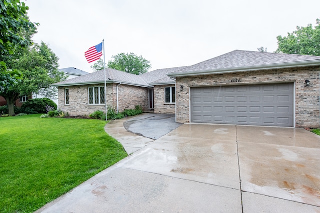 view of front of house with a front yard and a garage