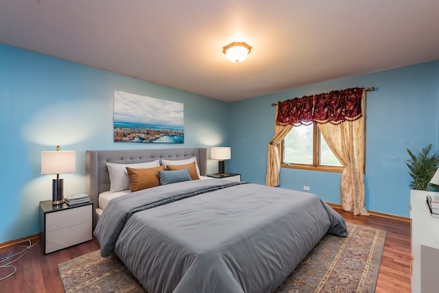 bedroom featuring dark hardwood / wood-style floors