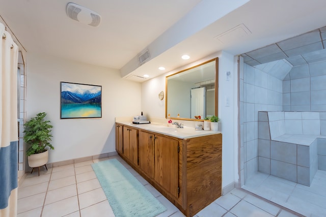 bathroom with vanity and tile patterned flooring