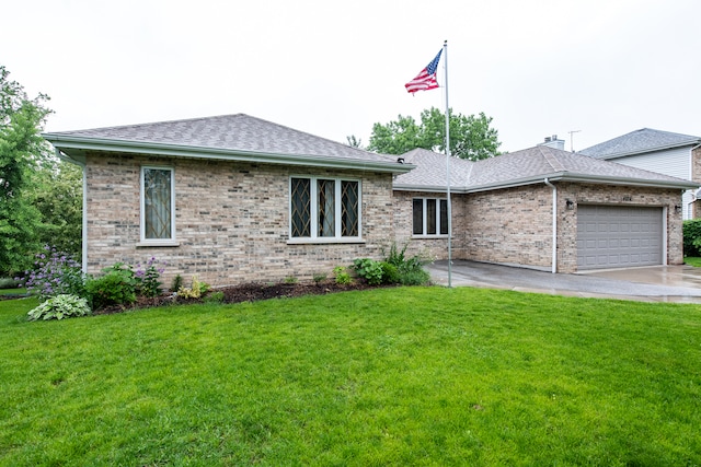 ranch-style house featuring a front yard and a garage