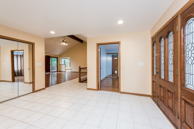 entrance foyer featuring light wood-type flooring, vaulted ceiling with beams, and ceiling fan