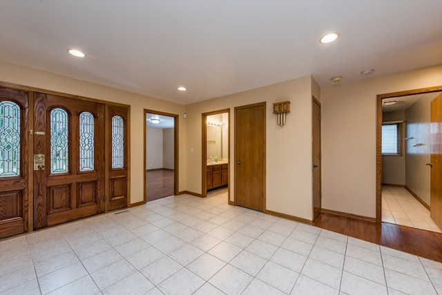 entrance foyer with light hardwood / wood-style flooring and sink