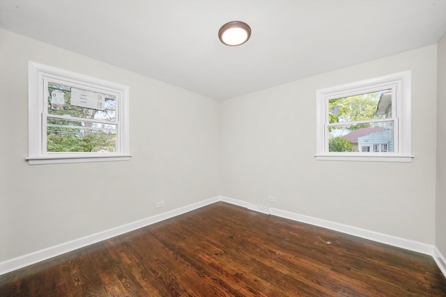 spare room with dark wood-type flooring