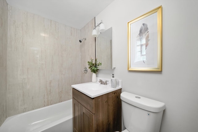 full bathroom with vanity, tiled shower / bath combo, and toilet