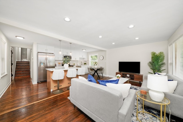 living room with dark hardwood / wood-style floors