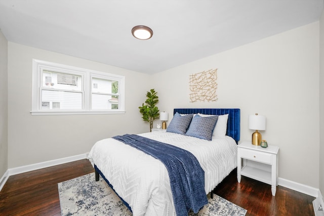 bedroom featuring dark hardwood / wood-style flooring