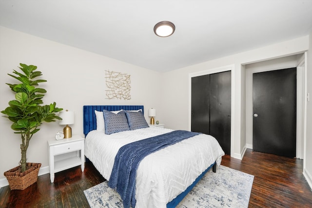 bedroom featuring dark hardwood / wood-style flooring