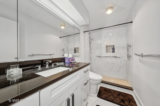 bathroom featuring vanity, toilet, and a shower with curtain