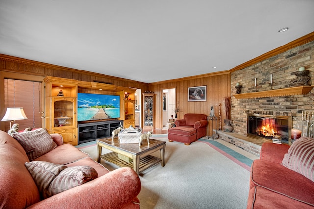 living room featuring ornamental molding, a brick fireplace, wooden walls, carpet, and built in shelves