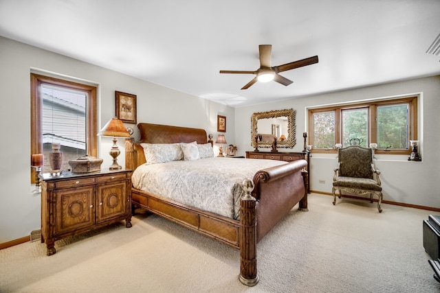 bedroom featuring light colored carpet and ceiling fan