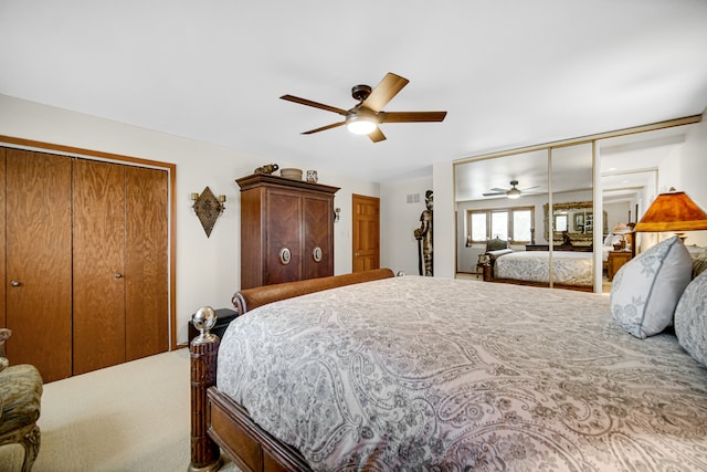 bedroom with two closets and ceiling fan