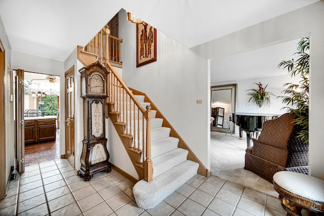 stairway with tile patterned flooring