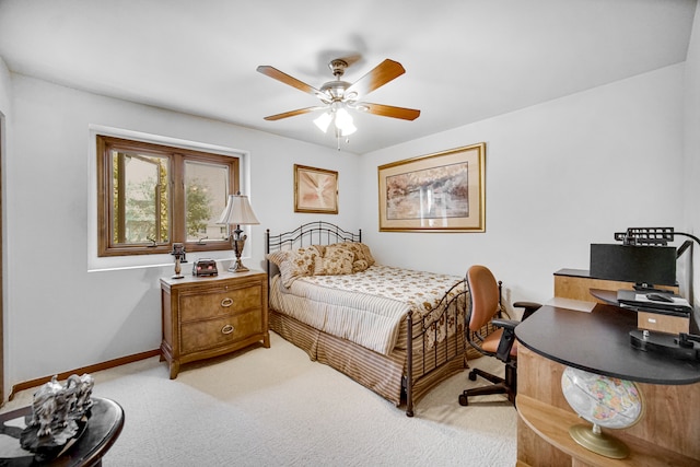 bedroom featuring light colored carpet and ceiling fan