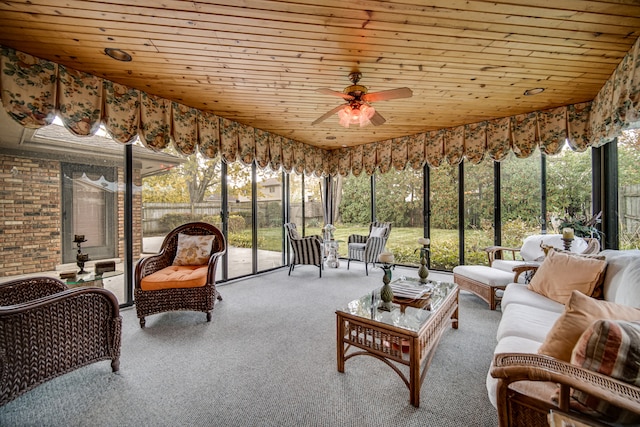 sunroom / solarium with ceiling fan and wooden ceiling