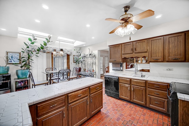 kitchen with sink, dishwasher, ceiling fan with notable chandelier, wine cooler, and range with electric stovetop