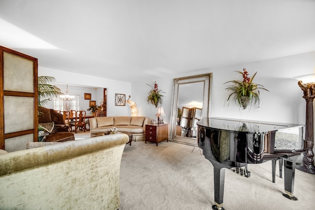 living room featuring light carpet and a chandelier