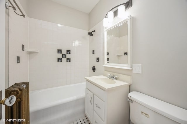 full bathroom with tiled shower / bath combo, vanity, toilet, and tile patterned floors