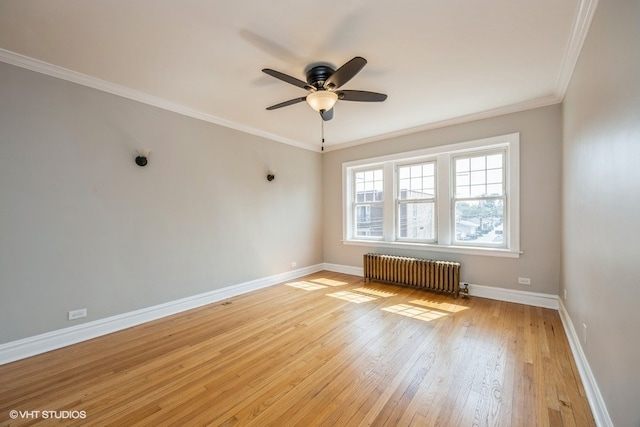 empty room featuring radiator heating unit, light hardwood / wood-style floors, ceiling fan, and crown molding