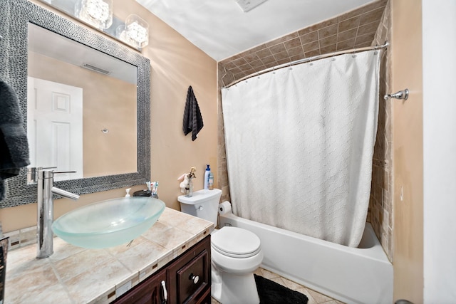 full bathroom featuring vanity, toilet, shower / bathtub combination with curtain, and tile patterned floors