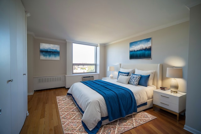 bedroom with radiator, dark hardwood / wood-style floors, and ornamental molding